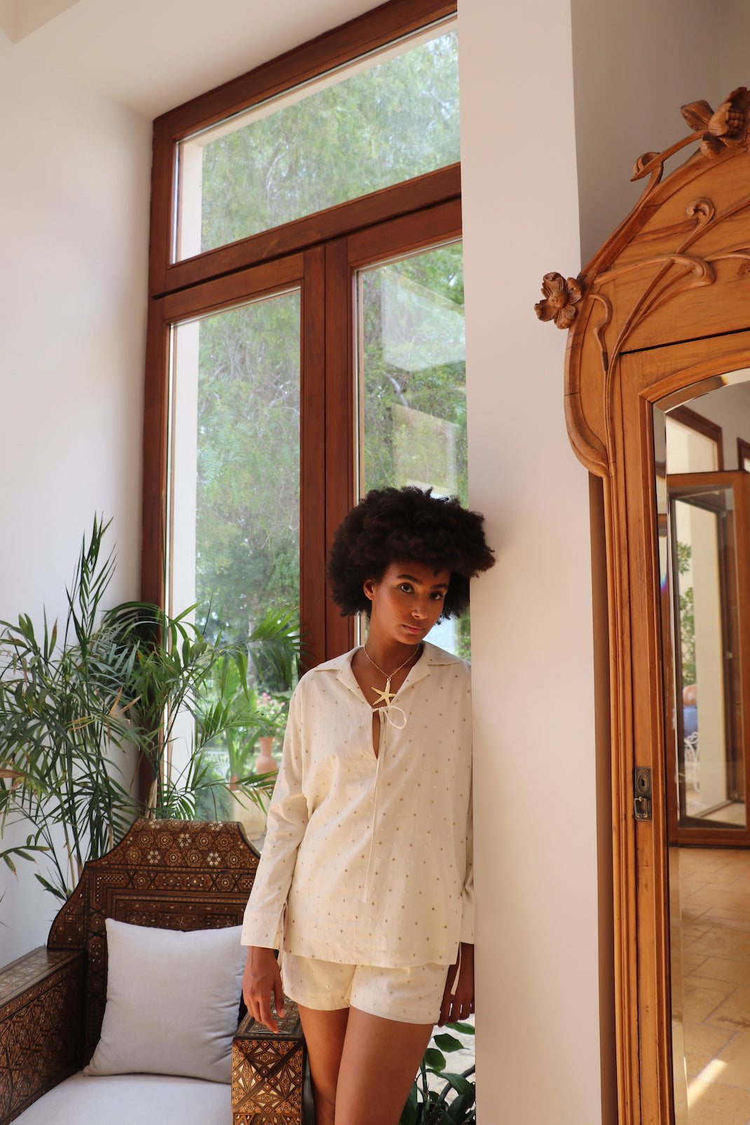 White cotton set with gold embroidered circles, relaxed fit shorts with pockets