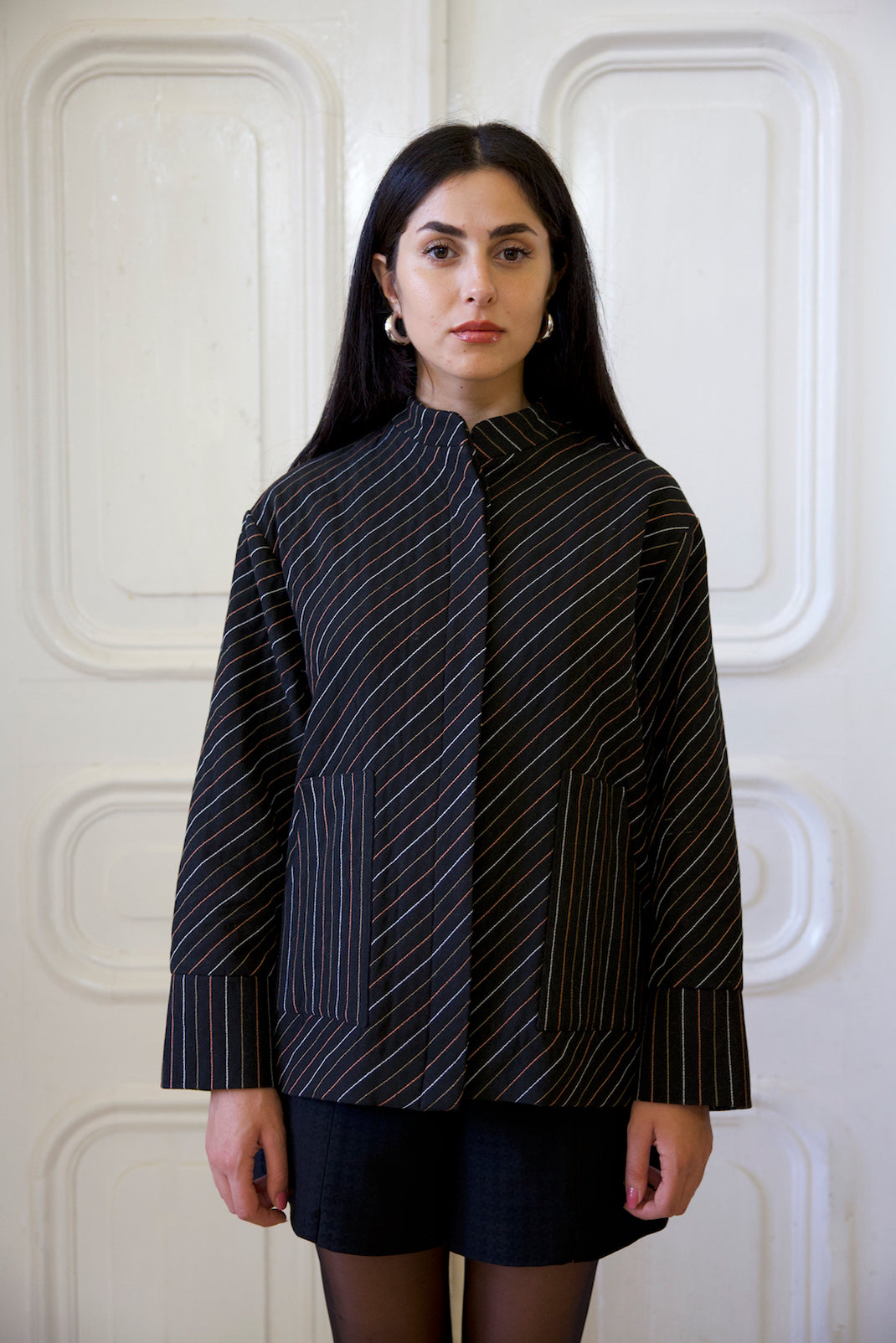 The Striped Jacket with button front, long sleeves and large pockets